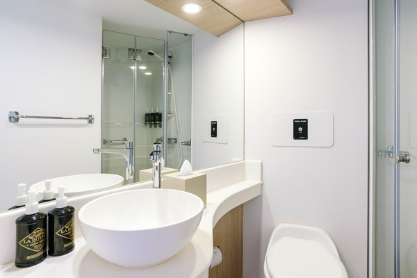 HX Hurtigruten Expeditions, Santa Cruz II, Cabin Bathroom, Credit - Clara Tuma.JPG